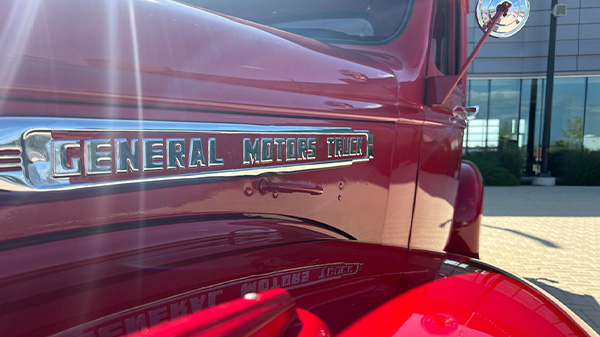 Old red general motors truck close up